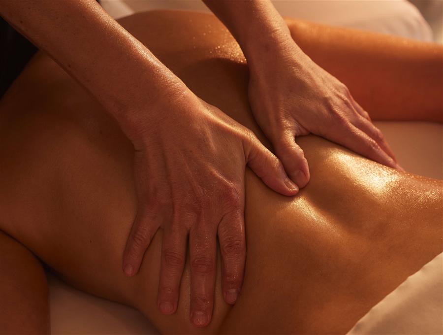 A woman getting her back massaged