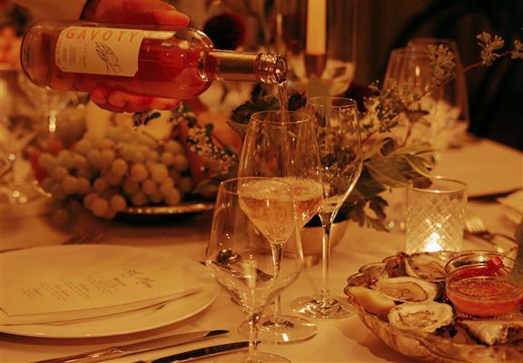 A dinner event with wine being served